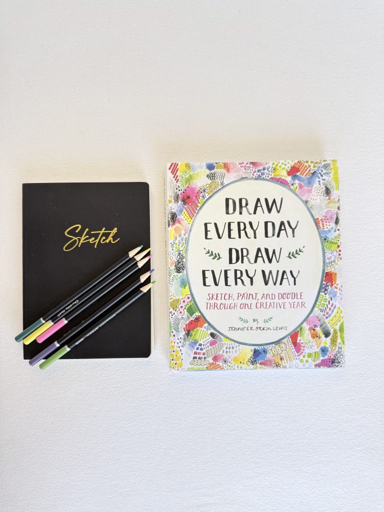 Sketch book with learn to draw book and pencils
